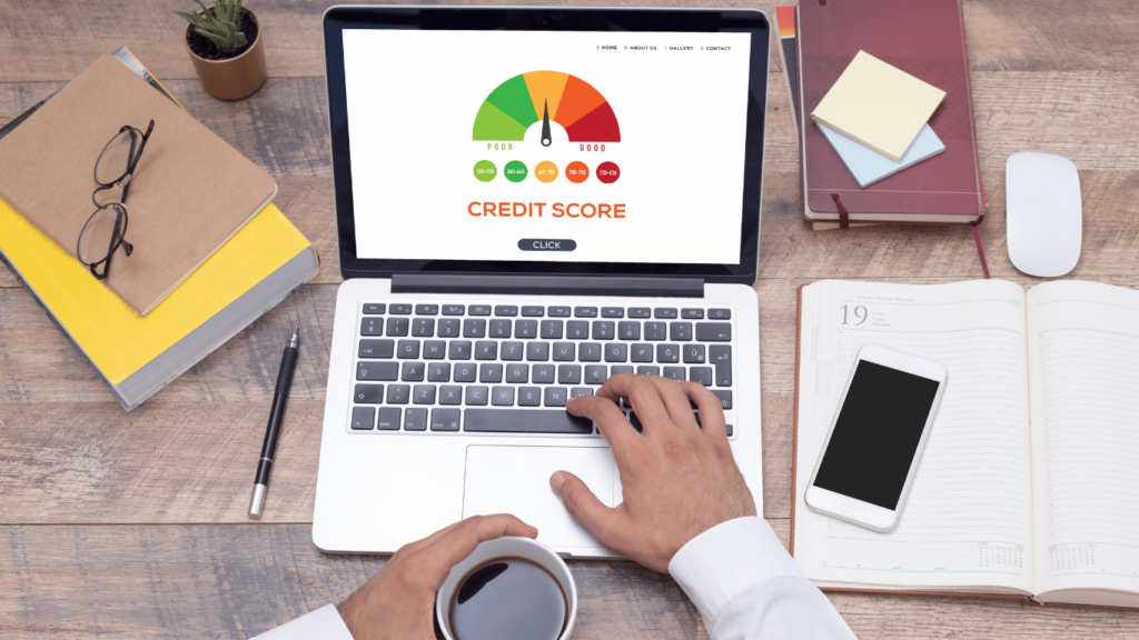 A person reviewing their credit score data on a laptop, demonstrating steps to Improve Your Credit Score with a visible gauge showing different credit score ranges.