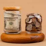 Two jars, one filled with rolled bills and the other with coins, symbolizing the balance between savings and Two-pot retirement system.